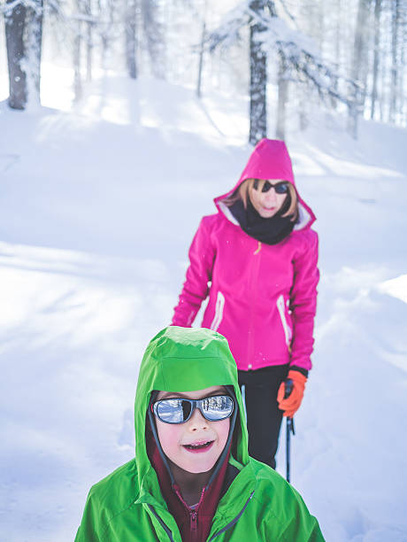 istock Mother and Son Snowshoeing 530777915