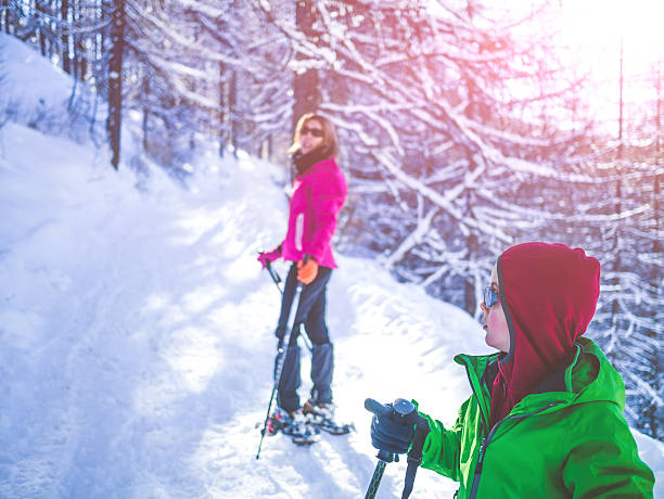 istock Mother and Son Snowshoeing 530778581