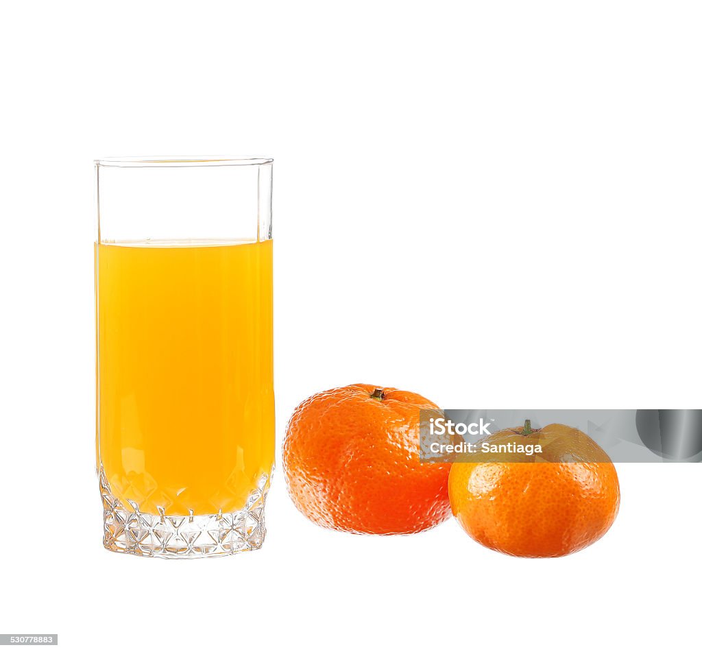 Orange juice in a glass with lime, orange, tangerine Alcohol - Drink Stock Photo