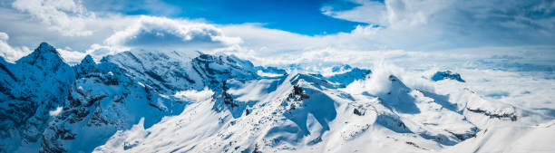 istock White mountains winter peaks panorama dramatic Alpine landscape above clouds 530781329