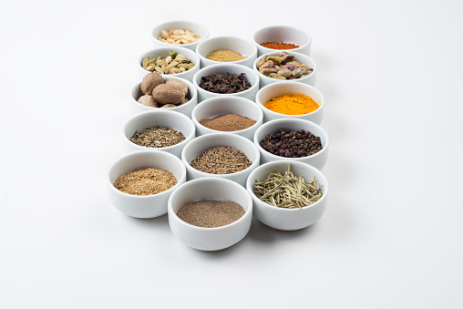 large collection of different spices and herbs isolated