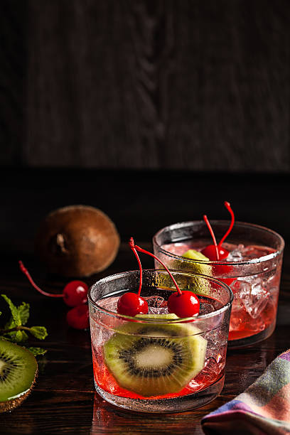 istock Cold summer cocktail drink with cherry and kiwi 530784453
