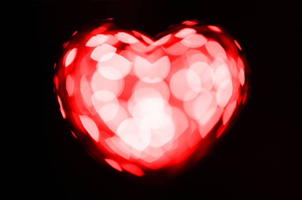 istock Red bokeh heart on black background 530797439