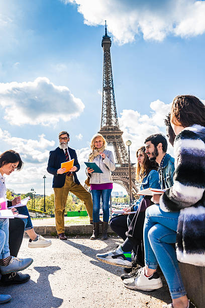 istock Students on travel in Paris - Tour Eiffel Outdoor lesson 530807148