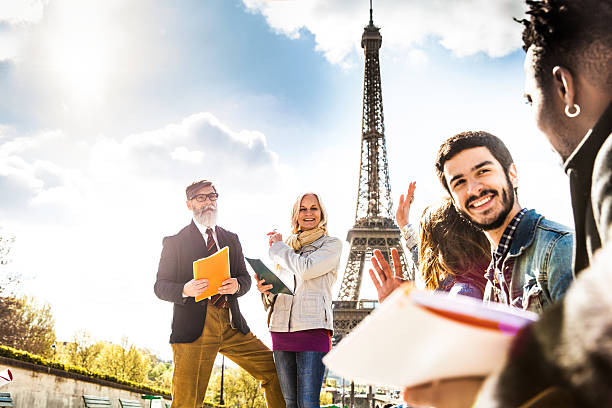 istock Students on travel in Paris - Tour Eiffel Outdoor lesson 530807606