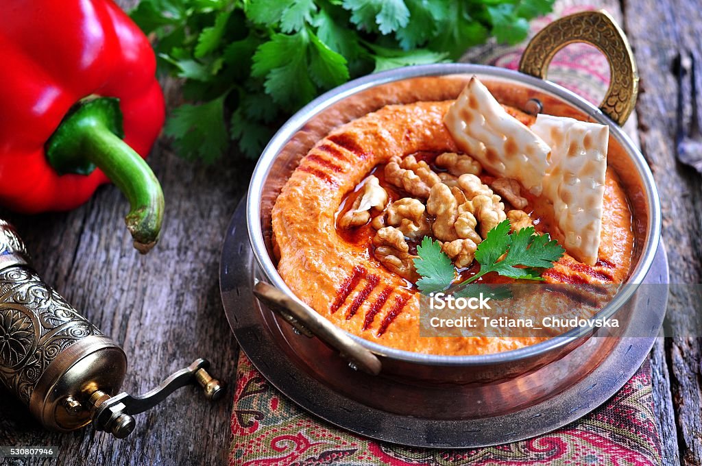 Muhammara dip of sweet peppers with walnuts, cumin, garlic Muhammara dip of sweet peppers with walnuts, cumin, garlic and olive oil. Bell Pepper Stock Photo