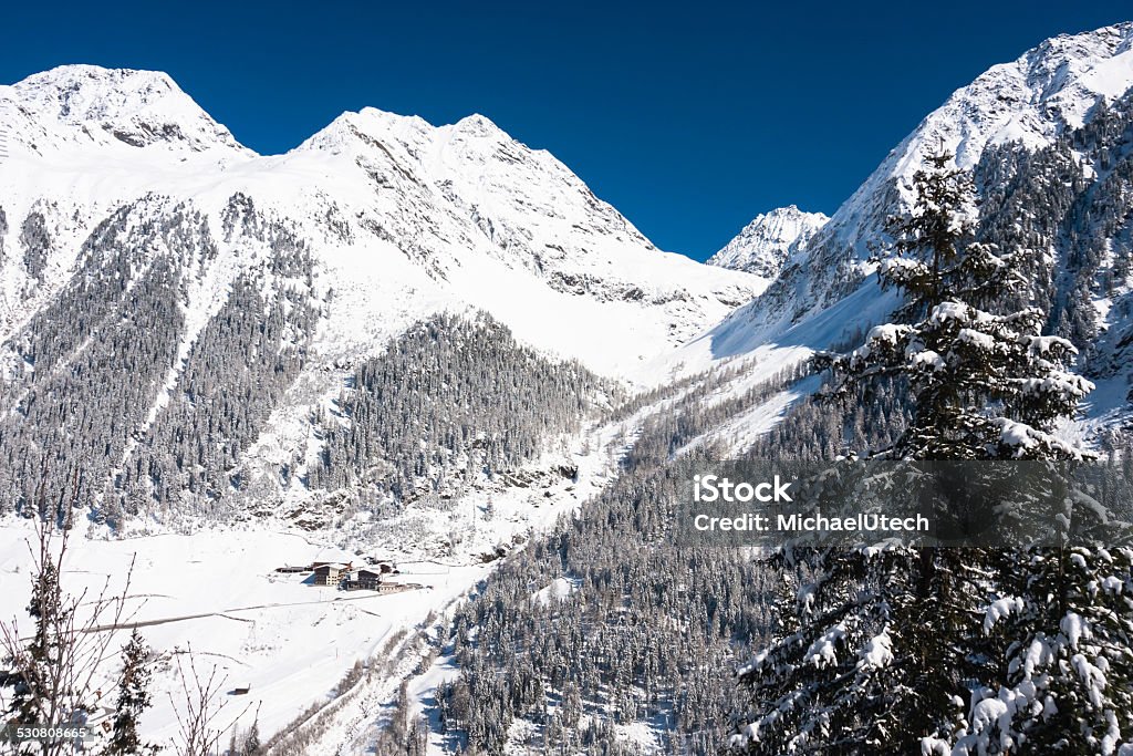 Winter Mountain Landscape Winter mountain landscape in the Austrian Alps with some houses in the background. 2015 Stock Photo