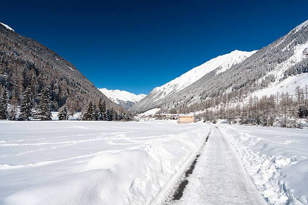 istock Road Through Winter Mountain Landscape 530808679