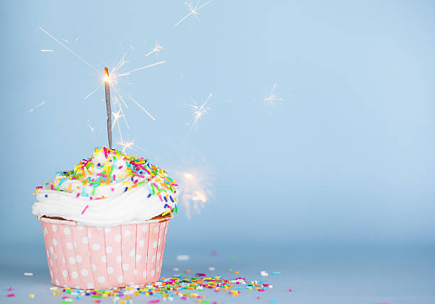 Cupcake with sparkler stock photo