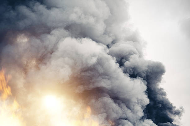 Fire Grey clouds of smoke in the sky. apocalypse fire stock pictures, royalty-free photos & images