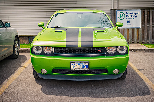 Hamilton, Canada - May 10, 2016: A green colored third generation Dodge Challenger R/T coupe parked in a parking lot.