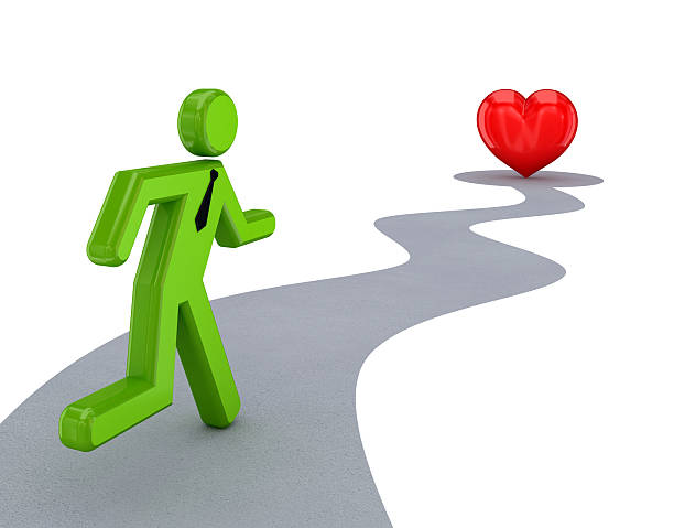 istock 3d small person running to a red heart. 530810337