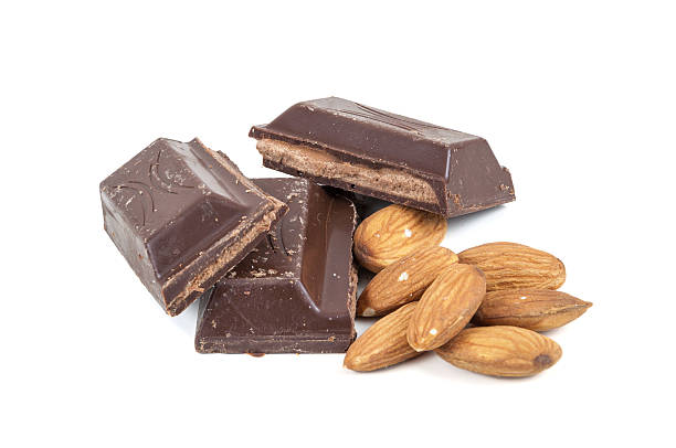 istock Chocolate pieces and almond on white background 530811089