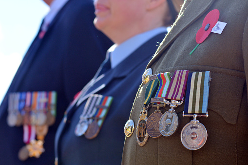 Mangonui, New Zealand - April 25, 2014: Close up of war medals on New Zealander soldiers during a National War Memorial Anzac Day services in New Zealand. 