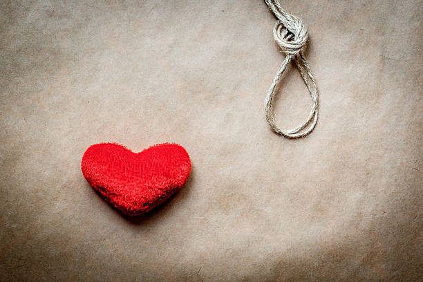 istock concept hangman knot with plush red heart 530812574