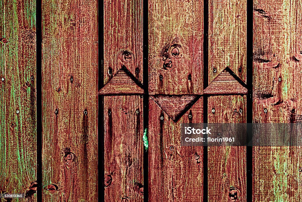 Vintage fence made of planks Vintage look a fence made from vertical planks of wood. Ancient Stock Photo