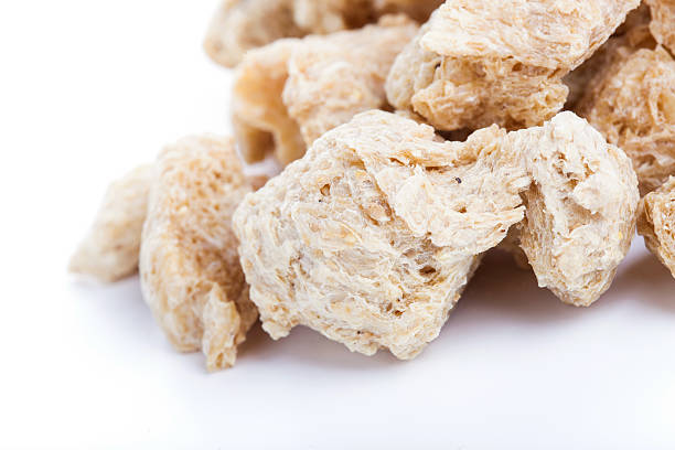 Raw Soya Chunks, Soy Meat for vegans Raw Soya Chunks, Soy Meat for vegans isolated on white background tsp stock pictures, royalty-free photos & images