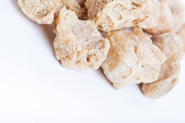 Raw Soya Chunks, Soy Meat for vegans Raw Soya Chunks, Soy Meat for vegans isolated on white background tsp stock pictures, royalty-free photos & images