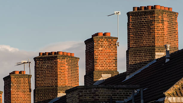 istock Typical English house chimneys. 530815104