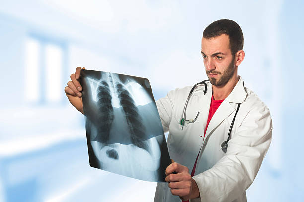 istock doctor looking at the x-ray 530815401