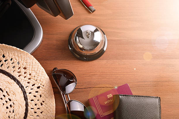 istock Tourist objects on wood table of hotel reception 530815872