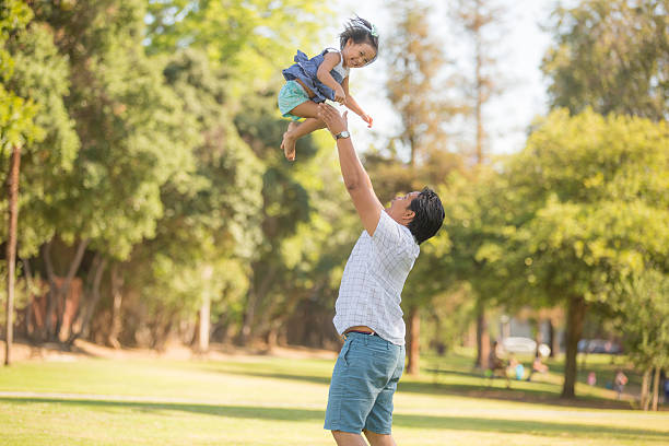 istock Ethnic father playing with his young daughter in the 530815908