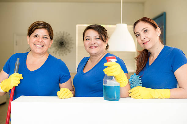 Hispanic cleaning ladies stock photo