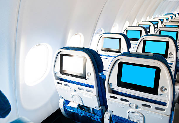 istock Airplane seat with screens in chairs back 530818048