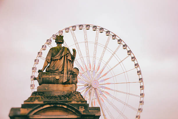 istock Marble sculpture and ferris wheel on Tuileries Garden, Paris. 530818090