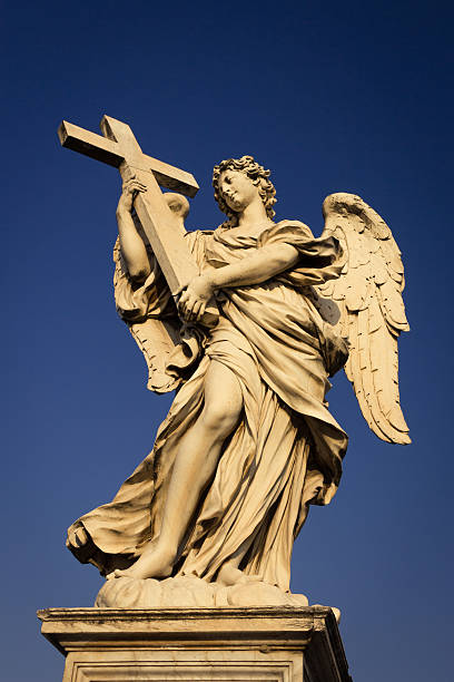 istock Angel with the Cross 530819418