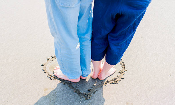 Couple on the beach Couple on the beach. co dependent relationship stock pictures, royalty-free photos & images