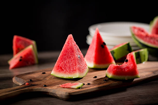istock Watermelon sliced on wood background 530822074