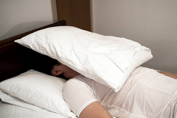 istock Asian man lying on the bed 530823206