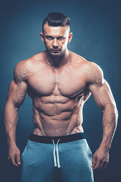 istock Strong Athletic Man Fitness Model Torso showing six pack abs 530824676