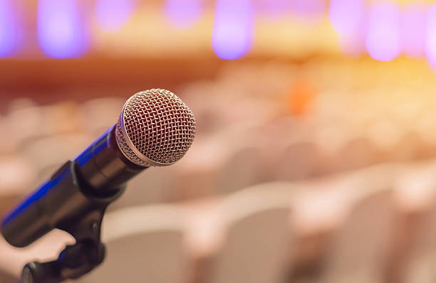 istock microphones in meeting room before a conference 530825136