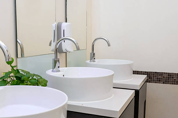 istock white basins in bathroom interior with granitic tiles 530825190