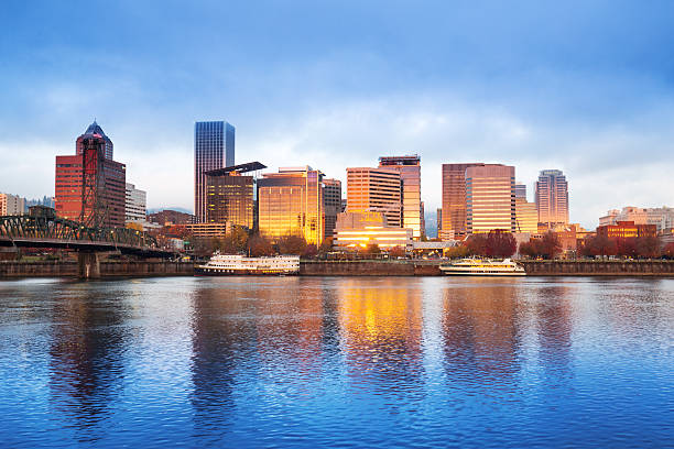 tranquil water,cityscape and skyline of portland at sunrise stock photo