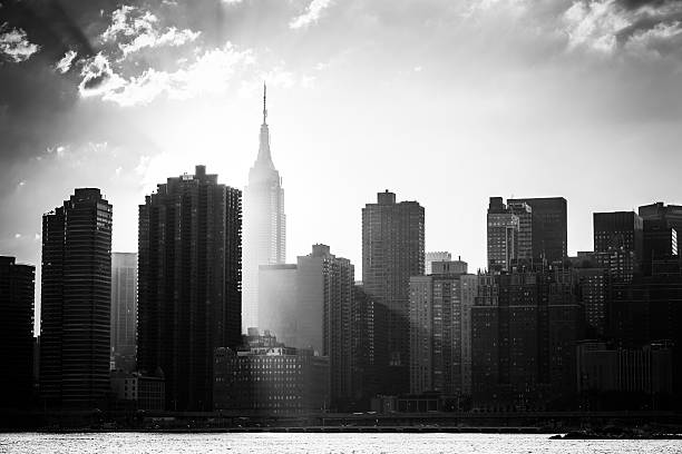 New York City Skyline Black and white shot of the Empire State Building and the New York City skyline east river new york city photos stock pictures, royalty-free photos & images