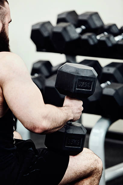 istock Photo Bodybuilder working out in the gym weights 530826354