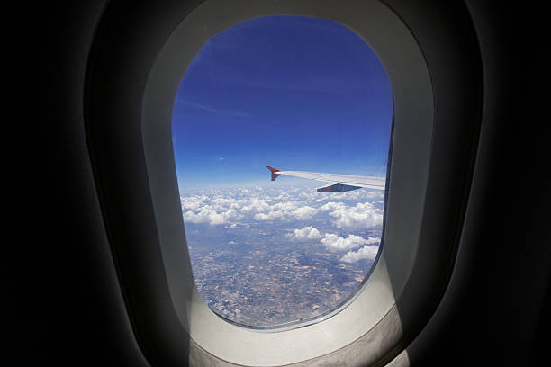 istock window aircraft during flight in wing with top view 530826688
