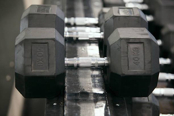 istock dumbbells in modern sports club. 530826818