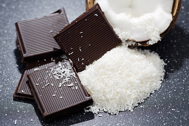 Dark chocolate and coconut desiccated on a old table