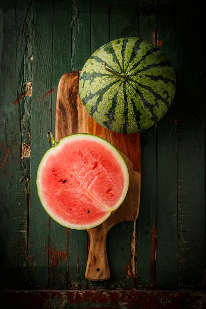 Watermelon sliced on wood background