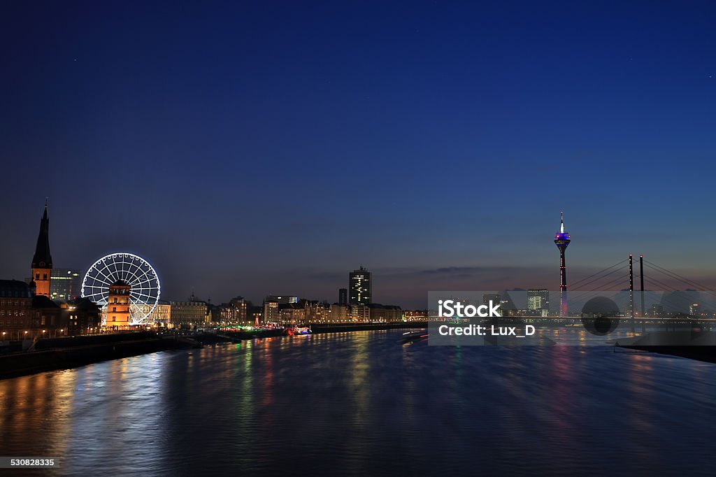 Dusseldorf Cityscape with Old Town and Harbor Dusseldorf cityscape along the rhine at night with a view on the old town, St. Lambertus church, Ferris Wheel, the Media Harbor, rhinetower and bridge Düsseldorf Stock Photo
