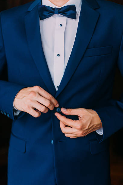 istock Man in stylish blue suit with a bow-tie stud 530828678