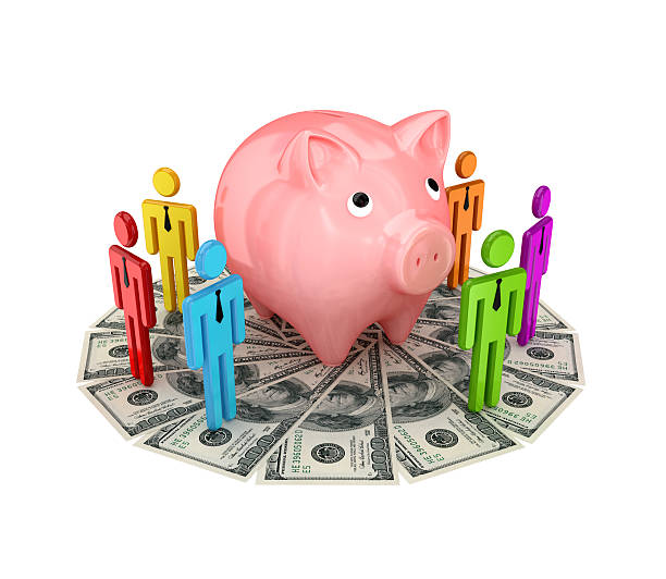 istock 3d small people around pink piggybank. 530828879