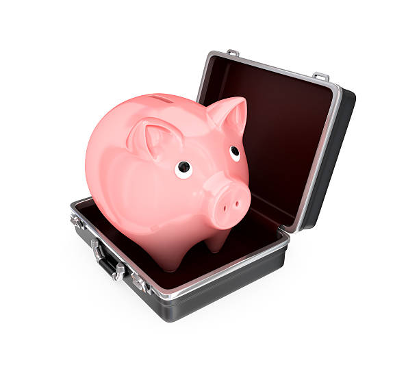 istock Opened suitcase and pink piggy bank inside. 530828897