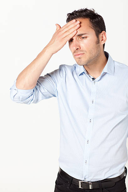 istock Mid-adult man suffering from headache 530828955