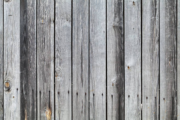 istock Old dark gray wooden wall background texture 530829245