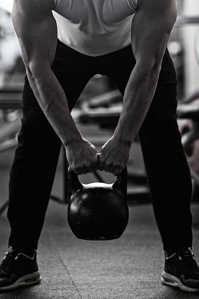 istock Photo bodybuilder doing weight lifting in gym. 530830452